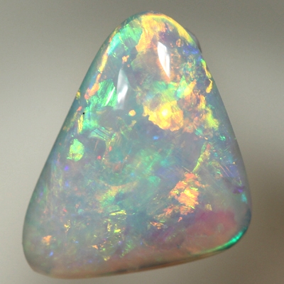 SOLID CRYSTAL OPAL Sparkles of orange and green in a 3D pattern 